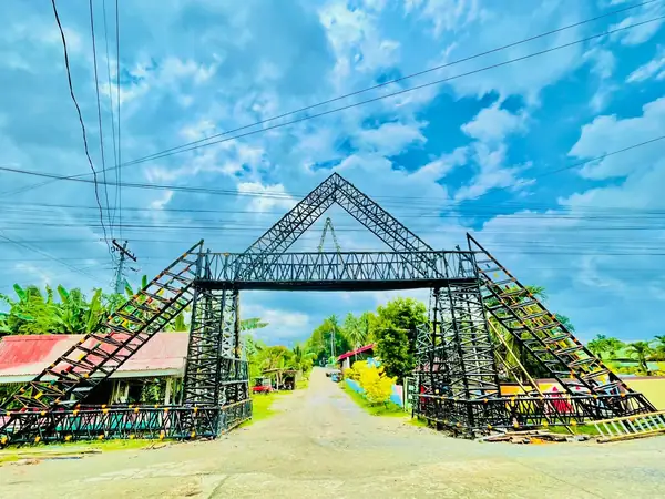 The scout arch under construction in Kagawasan, its steel trusses raised before the banner was mounted